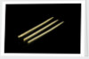 Three paper 'cocktail sticks', one still has a needle in it by unknown