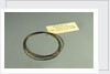Roll of brass wire in a bag by unknown