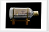 A bottle containing a model ship by unknown