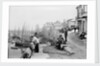 Newlyn Harbour, Cornwall. The old harbour with fishermen looking out to sea. by Francis Frith & Co.