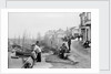 Newlyn Harbour, Cornwall. The old harbour with fishermen looking out to sea. by Francis Frith & Co.