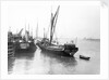 The 'Olive May' (1920), a port quarter view of the barge motoring to quayside with her tender in tow (sails furled) by Anonymous