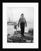 Gunner William G. Worsh of the destroyer 'Swallow' proudly showing off his latest comforts from home, a hand-knitted cardigan and balaclava by Unknown