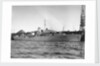 Photograph of starboard view just forward of the broadside of HMS 'Rhododendron' (1940) dated pre October 1942 alongside quay. Pendant K78. by unknown