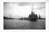HMS 'Titania' (1915) submarine depot ship, moored at Portland with 4 submarines alongside by unknown