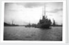 HMS 'Titania' (1915) submarine depot ship, moored at Portland with 4 submarines alongside by unknown