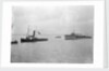 Rescue tug HMS 'Vanquisher' (1899) entering the floating dock at Harwich with the mined destroyer 'Thisbe' (1917) in tow by unknown