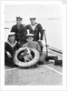 Photograph of four petty officers on board 'Laforey' (1913) at Harwich in 1915-1916 with the ship's dog mascot by unknown