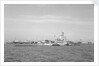 Aircraft carrier HMS 'Illustrious' (1939) in June 1953, anchored in Line F at Spithead for the Coronation Review. The aircraft lighter 'R.N.AIR' is alongside by unknown