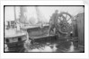 The 'Herzogin Cecile' (Fi, 1902) a seaman at the midships wheel in heavy weather. The helmsman is wearing a safety harness by unknown