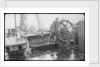The 'Herzogin Cecile' (Fi, 1902) a seaman at the midships wheel in heavy weather. The helmsman is wearing a safety harness by unknown