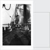 One of the crew on the forecastle head capstan by Alan Villiers