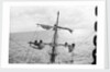 Aloft on the Mizzen furling the blown-out sails by Alan Villiers