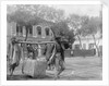 Two Chinese men carrying a load suspended from a pole between them by Kenneth Hurlstone Jones