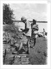 A British government official checking mangrove poles by Alan Villiers