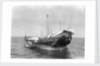 A baggala at anchor off Zanzibar discharging her cargo by Alan Villiers