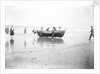 Five fishermen carrying a Sheringham crab boat up the beach, assisted by three boys, at Lowestoft by Smiths Suitall Ltd.