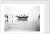 Five fishermen carrying a Sheringham crab boat up the beach, assisted by three boys, at Lowestoft by Smiths Suitall Ltd.