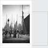 Men and women onlookers at the end of the quay looking at the forest of masts and sails in the harbour at Lowestoft, Suffolk by Smiths Suitall Ltd.
