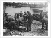 Folkestone, Kent. Sorting fish on the harbour slipway at low water by unknown