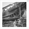 A close port side view of a Hong Kong fisher d.w. type junk repairing on a slipway at Hong Kong by David Watkin Waters