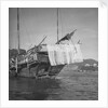 A port quarter view of an Aberdeen frame stern fisher type junk in Hong Kong harbour by David Watkin Waters