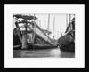 A starboard quarter view of an Hangchow Bay trader type junk moored with other junks at Shanghai by David Watkin Waters