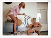 Exercise, hilarity and hijinks combined: a couple enjoy the novel pleasures of a 'bucking bronco' machine on board an unspecified cruise ship by Marine Photo Service