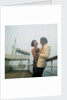 A misty evening offers amorous opportunities on deck for a romantic, smartly dressed, couple on a cruise ship by Marine Photo Service