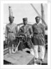 Three Lascars of the 'Viceroy of India' (1929), standing behind the wheel of one of the ship's tenders by Marine Photo Service