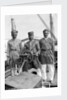 Three Lascars of the 'Viceroy of India' (1929), standing behind the wheel of one of the ship's tenders by Marine Photo Service