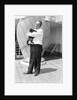 Steward with ship's cat by Marine Photo Service