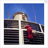 Father Christmas, or Santa Claus, climbing the grill in front of the forward funnel above the bridge on 'Oriana' (1960) by Marine Photo Service