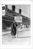 A Tunisian tour guide posing with his official P & O sign, Bizerte, Tunisia by Marine Photo Service