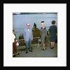 Unidentified couple posing in front of the Mermaid sculpture, Copenhagen, Denmark by Marine Photo Service