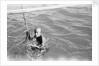 A Kuwaiti pearl diver draws breath between dives by Alan Villiers