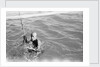A Kuwaiti pearl diver draws breath between dives by Alan Villiers