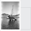 A small Yemeni sambuk lies at anchor, Ma'alla by Alan Villiers