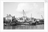 Booms anchored along the waterfront at Mombasa, Kenya by Alan Villiers