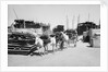 Water donkeys carry full goatskins into town by Alan Villiers