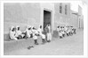 Sailors relaxing outside a merchant's house by Alan Villiers