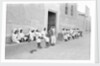 Sailors relaxing outside a merchant's house by Alan Villiers