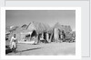 Jizan market with 'ushshah' houses by Alan Villiers