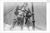 Sailors climbing the halyard blocks by Alan Villiers