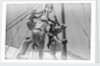 Sailors climbing the halyard blocks by Alan Villiers