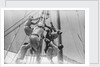 Sailors climbing the halyard blocks by Alan Villiers