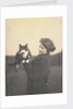 An informal photograph of Kathleen Alice Taylor holding Slabbie the black/white cat in her hands by Unknown