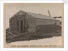 Davies, the carpenter, working on the hut by Herbert George Ponting