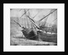 Bow view of two unidentified vessels at low tide by unknown