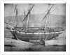 Broadside view of two unidentified vessels at low tide by unknown